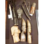 Quantity of African carvings including wooden tusks