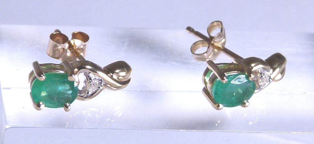 10 K gold emerald and diamond stud earrings,