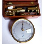 Boxed brass field microscope and a Negretti & Zambia compensated barometer