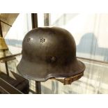 German WWII M1984 helmet with original strap and replacement liner,