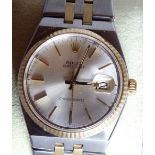 Gents Rolex Oyster Datejust brushed steel quartz bimetallic wristwatch on a brushed steel