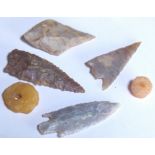 Four British flint arrowheads and two pressed amber beads