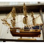 Wooden hull rigged sailing ship on stand