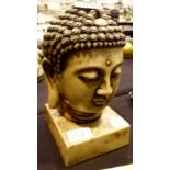 Carved Indian stone head on plinth,