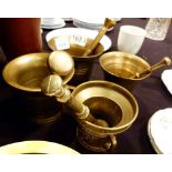 Four brass pestle and mortars