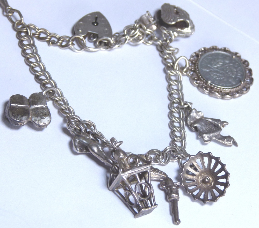 Silver charm bracelet with 12 charms