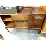 Oak sideboard with three central drawers and twin end cupboards,