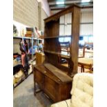 Antique oak dresser with double cupboards and two upper shelves,