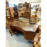 Bow fronted glass top dressing table with twin drawers and upper folding mirror