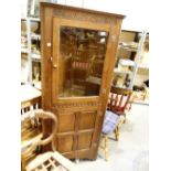 Oak corner unit with single glazed door and under cupboard