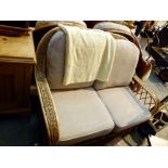 Three piece cane conservatory suite with two arm chairs and a two seater settee
