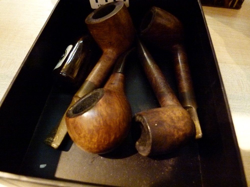 Box of mixed pipes and a miniature Guinness bottle