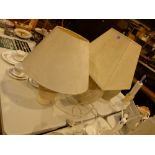 Two ceramic table lamp bases with cream shades