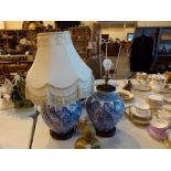 Pair of ceramic lamp bases in an oriental style with one lampshade