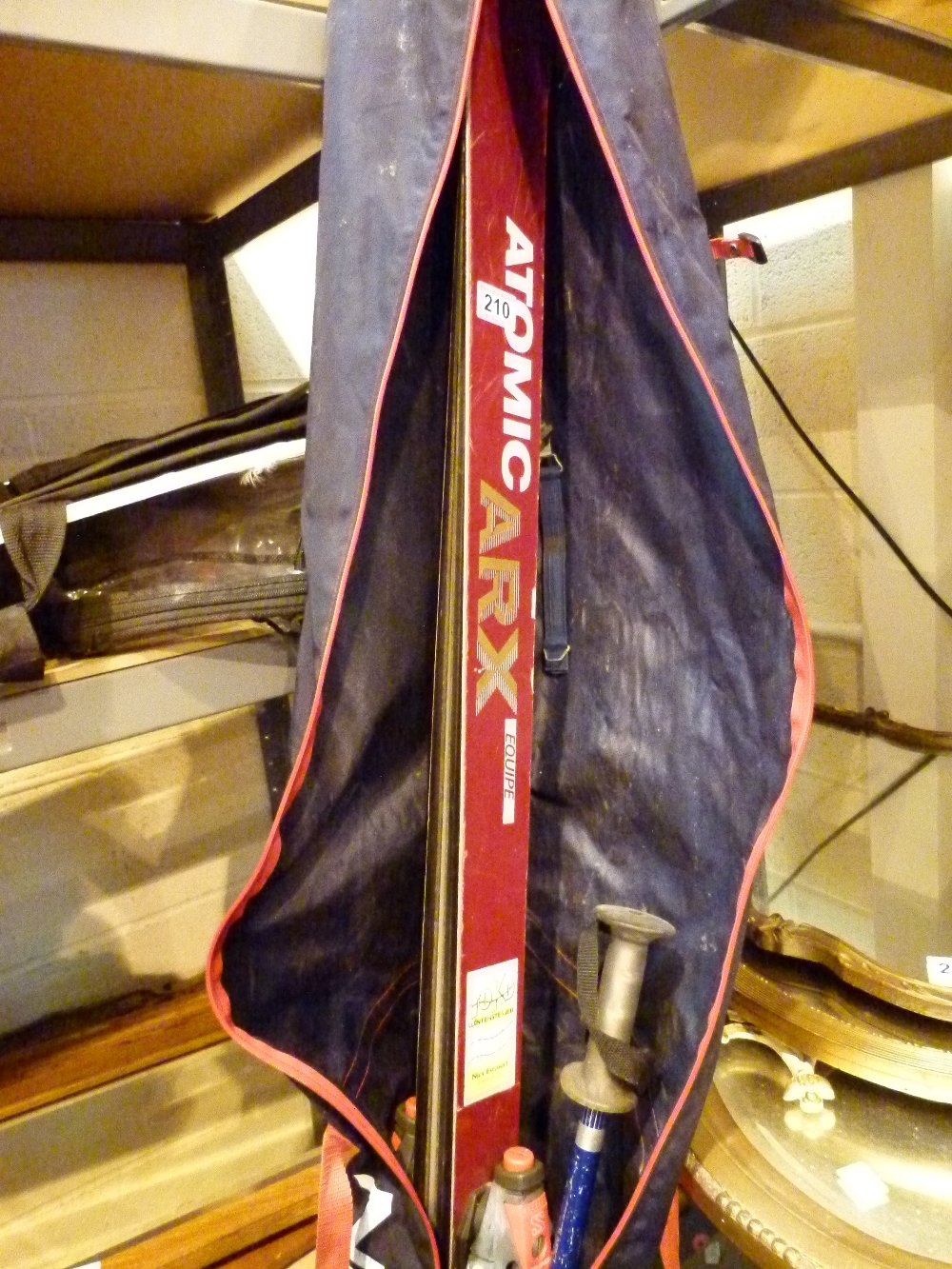 Pair of wooden skis in bag