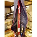 Pair of wooden skis in bag