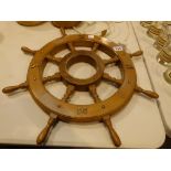 An ornamental ship's wheel,