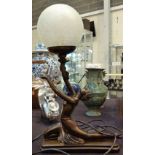 Art Deco style lamp of bronzed nude holding an orb