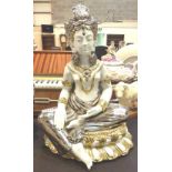 Oriental figurine of meditating lady in white and gold