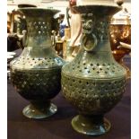 Pair of oriental turned and pierced vases H: 28 cm