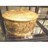 Circular wooden carved lidded box depicting elephants