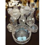 Twelve pieces of glassware, mostly crystal, including six decanters, fruit bowl,