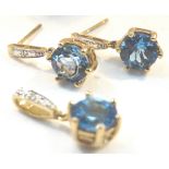 9ct gold mounted topaz earrings and a matching pendant