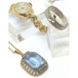 Rolled gold blue topaz pendant,
