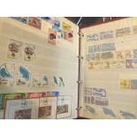 Four worldwide postage stamp album and a box of loose stamps