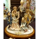 Capodimonte family group on hardwood stand, signed Cortess, no 373,