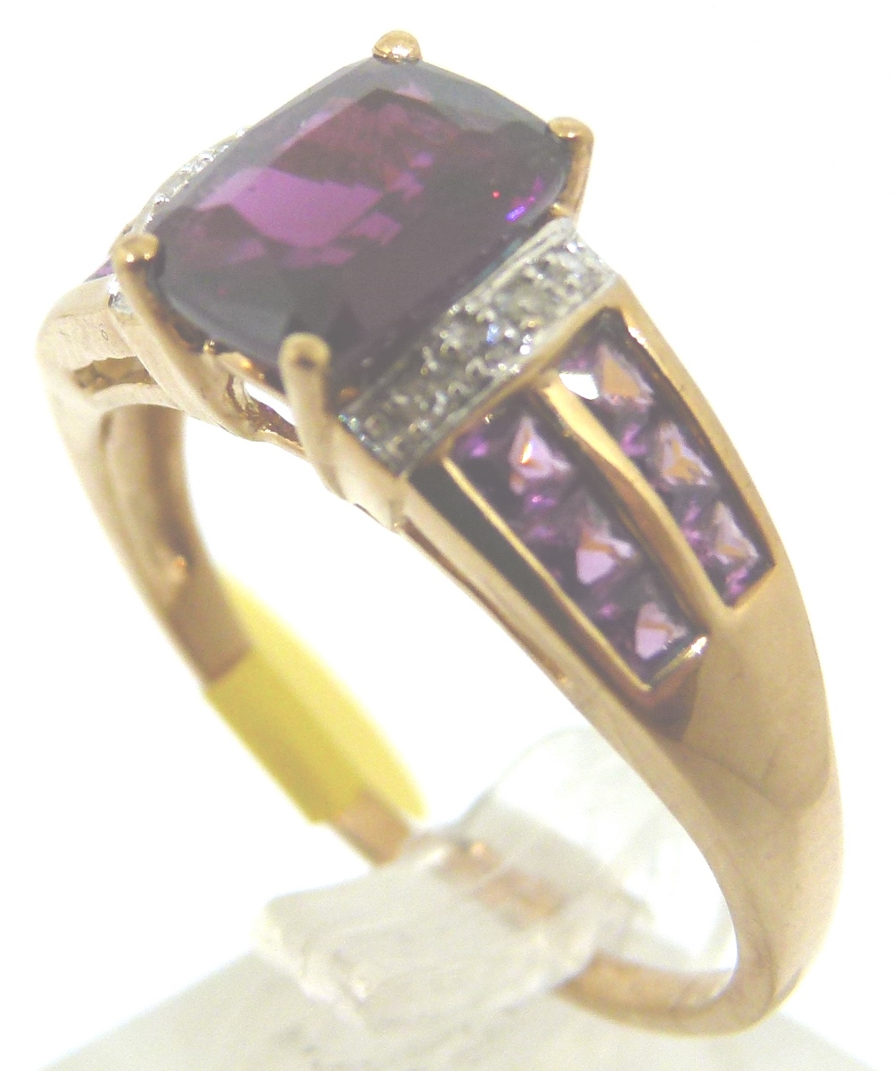 9ct gold almandine garnet and diamond ring,