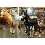 Three Beswick horses and a foal