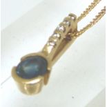 9ct gold sapphire and diamond pendant on 9ct curb chain,