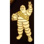 Wall mounted metal Michelin man,