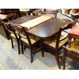 Large mahogany dining table with six chairs including two carvers and a large display unit