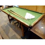 Small snooker table balls and cues,