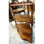 Regency mahogany four tier whatnot stand raised on turned supports