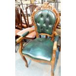 Upholstered button back green leather armchair