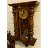Oak cased wall clock with key and pendulum