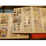Four stock albums of mixed worldwide postage stamps