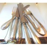 Five silver plated knives and silver sugar tongs