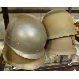 Four American military helmets