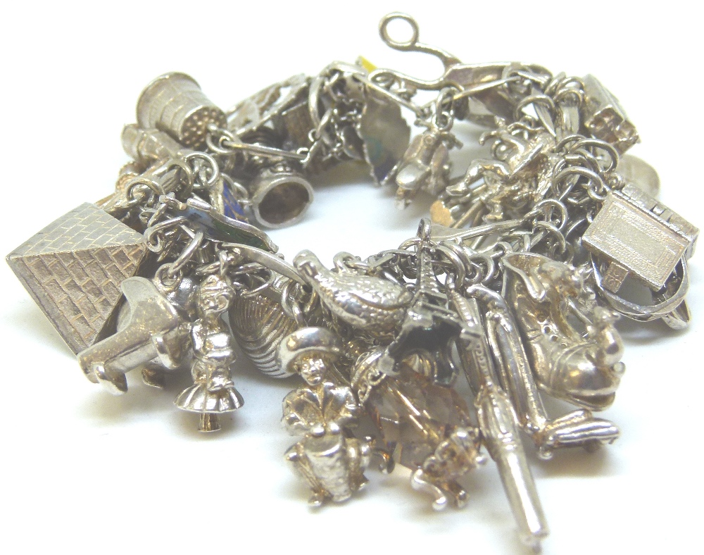 Sterling silver vintage charm bracelet full of assorted silver charms