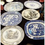 Six meat platters, mainly blue and white,