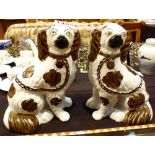 Pair of ceramic mantle dogs with pierced legs