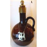 Early purple blown glass brandy flask with broken pontil and white metal brandy label.