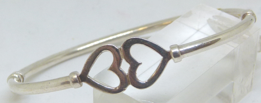 Sterling silver twin heart hinged bangle