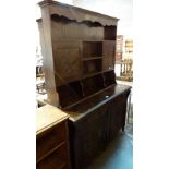 Late Victorian dark oak heavily carved Arts and Crafts side board with rear plate rack