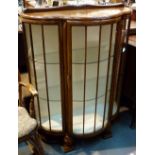 Vintage bow front display cabinet with glazed door and sides,