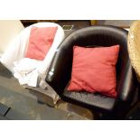 Pair of leather tub chairs with fitted set of check covers